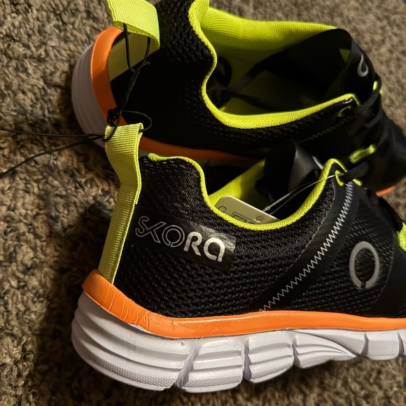 Black and Orange Athletic Shoes with Modern Design